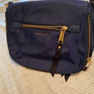 Marc jacobs navy canvass crossbody with gold trim.